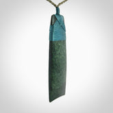 Hand carved from a lovely piece of local New Zealand Jade. We have suspended this from a olive cord which can be adjusted with a couple of slip knots.